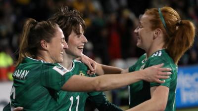 Rebecca Holloway celebrates with Kirsty McGuinness and Rachel Furness