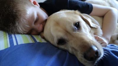 Joel Sayer cuddles his dog Caddie.