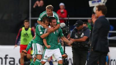 Martin Paterson celebrates scoring with Northern Ireland teammates Niall McGinn and Jamie Ward