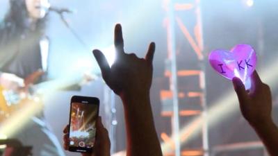 Still of cheering fans' hands