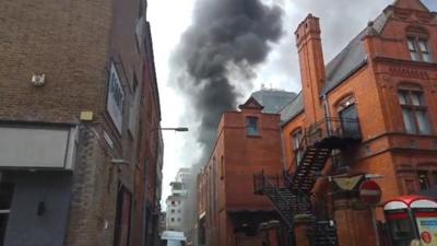 Black smoke was seen rising from the car park