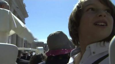 Children ride on Popemobile