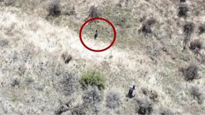 Drone view of child alone in countryside