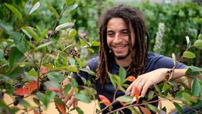 Tayshan Hayden-Smith, from Grow2Know, in the Peter Rabbit Garden