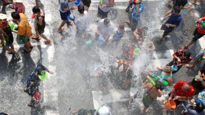 Water fight in street