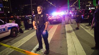 Policeman standing near crime tape