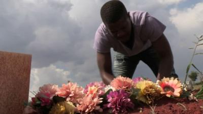 Man tending grave