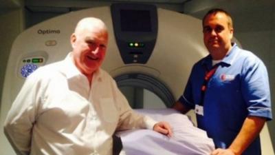 Paul Murphy with one of the portable Lung Health Check CT scanners and radiographer Mark Iwankiw