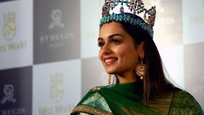 Manushi Chhillar wearing a crown