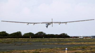 The Solar Impulse 2 airplane, piloted by Andre Borschberg, lands at Kalaeloa Airport in Kapolei, Hawaii, after flying non-stop from Nagoya, Japan,