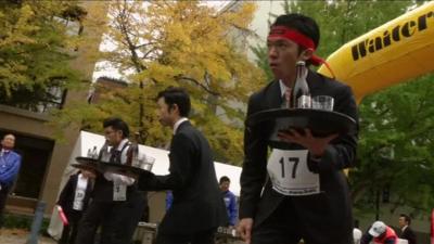 Waiters taking part in the Waiters' Race Japan held in Yokohama on Monday 23 November 2015