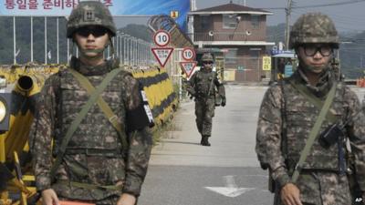 South Korean army soldiers on Unification Bridge near the border village in South Korea where talks are taking place with the North