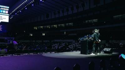 DJ Playing in an empty stadium