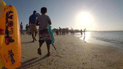 People on beach in Sri Lanka