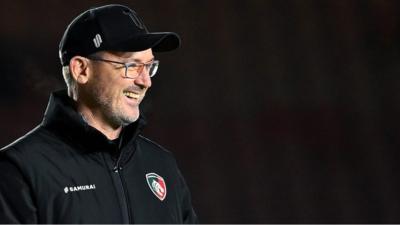 Leicester Tigers head coach Dan McKellar smiles on the sidelines