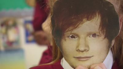 Girl wearing Ed Sheeran mask