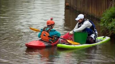 Canoeists pick litter on the River Medway