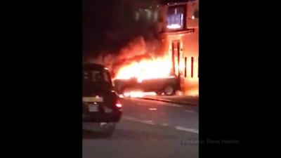 Car alight outside Glasgow nightclub