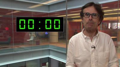 Robert Peston stands in front of a superimposed digital countdown showing zero