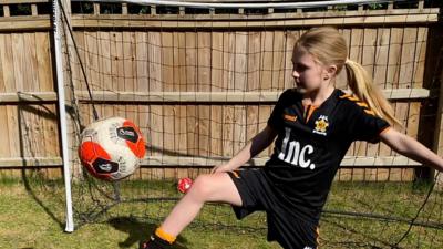 Imogen Papworth-Heidel doing keepy-uppies