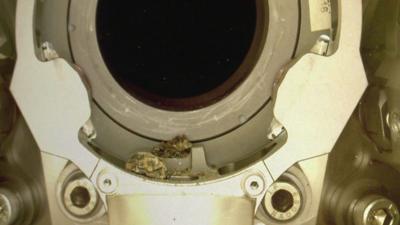 Pebbles shown caught up on the Mars Perseverance Rover