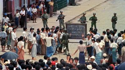 Students Protesting in front of soldiers in Burma