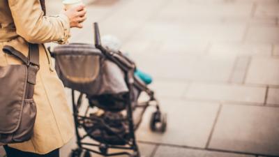 A woman pushing a pram