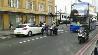 Mobile phone footage of woman apparently being "attacked" by bus driver