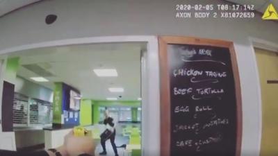 Man threatens officer with microwave