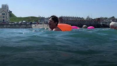 Swimmers in the sea off NI's coast