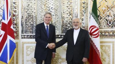 Philip Hammond (left) and Mohammad Javad Zarif