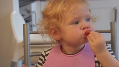 A toddler eating