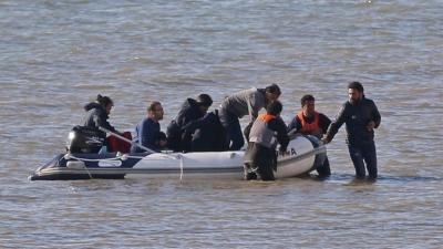 Migrants trying to reach the UK from France via boats are using "surge tactics" to increase their chances of getting past patrols, the National Crime Agency says.