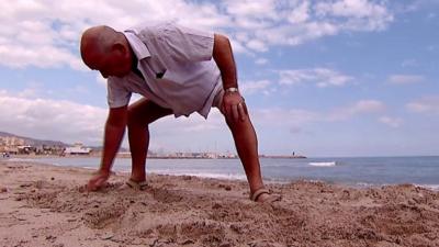 Man on beach in Spain