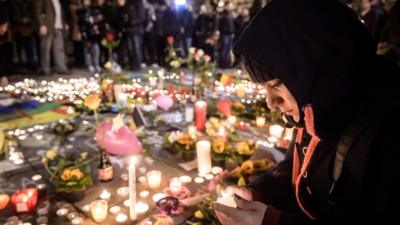 People gather and light candles during a vigil to pay tribute to the victims of the attacks in Brussels, Belgium. 22 March 2016