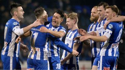 Coleraine players celebrate victory over Carrick Rangers