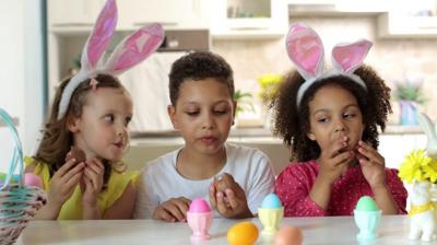 Children eating Easter eggs