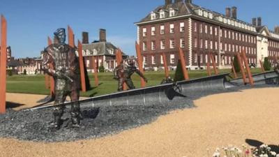 Sculptures of WWII soldiers, made of thousands of individually welded washers.