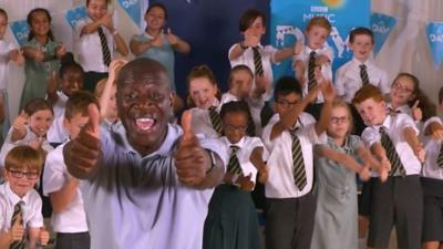 Wayne and kids showing thumbs up to camera