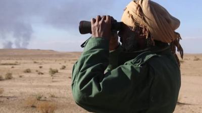 Man with binoculars