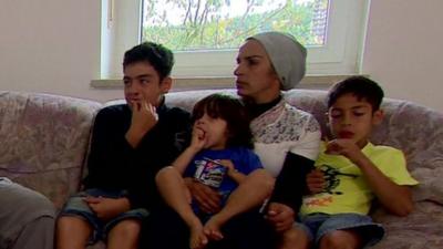 Family sitting on a sofa in Germany