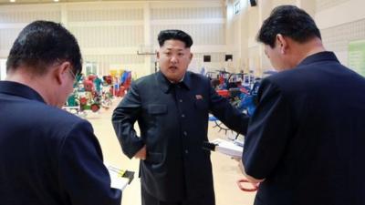 North Korean leader Kim Jong-Un visiting a farm machine exhibition
