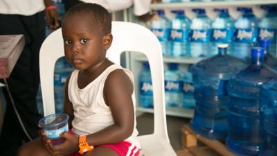 Child holding water