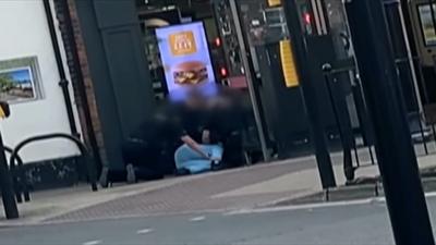 Man being detained by police