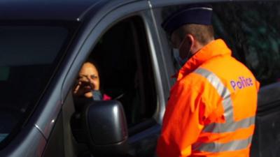 a border guard checks a car