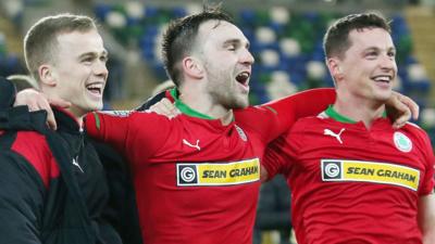 Cliftonville players celebrates after their semi-final victory