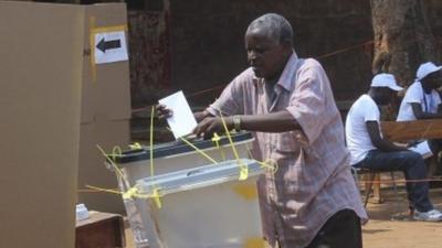 Man casts ballot in Burundi