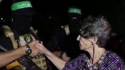 Hostage shakes masked Hamas captor's hand