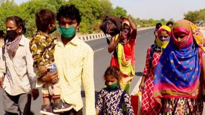 Family walking beside highway