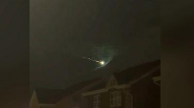 Fireball shooting across night sky